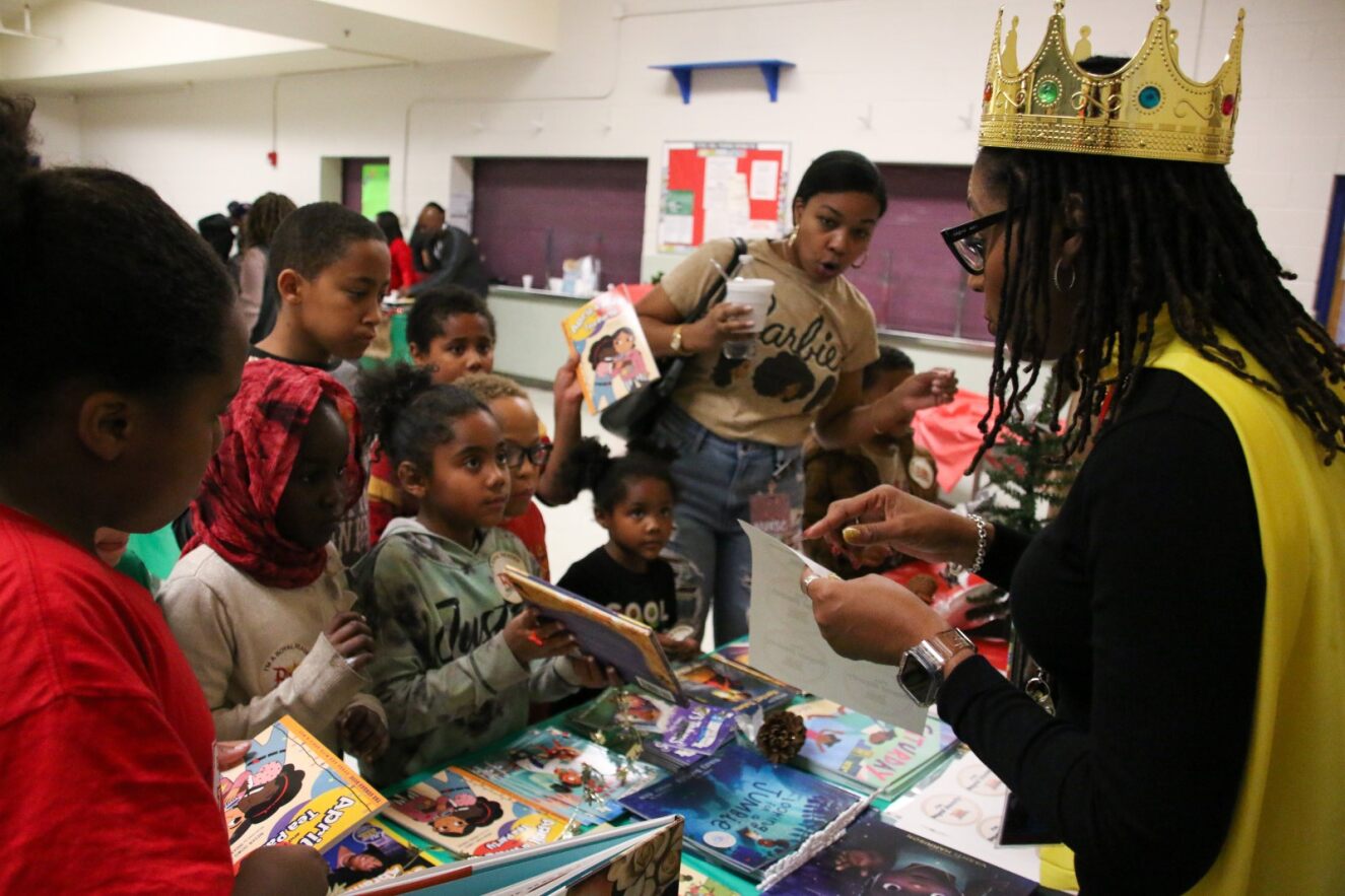 AASSD Director Tonya Strozier talks with students during the Royal Readers Ball.