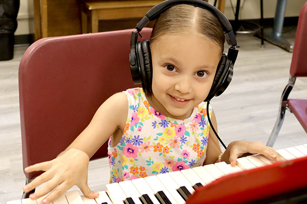 Girl playing keyboard