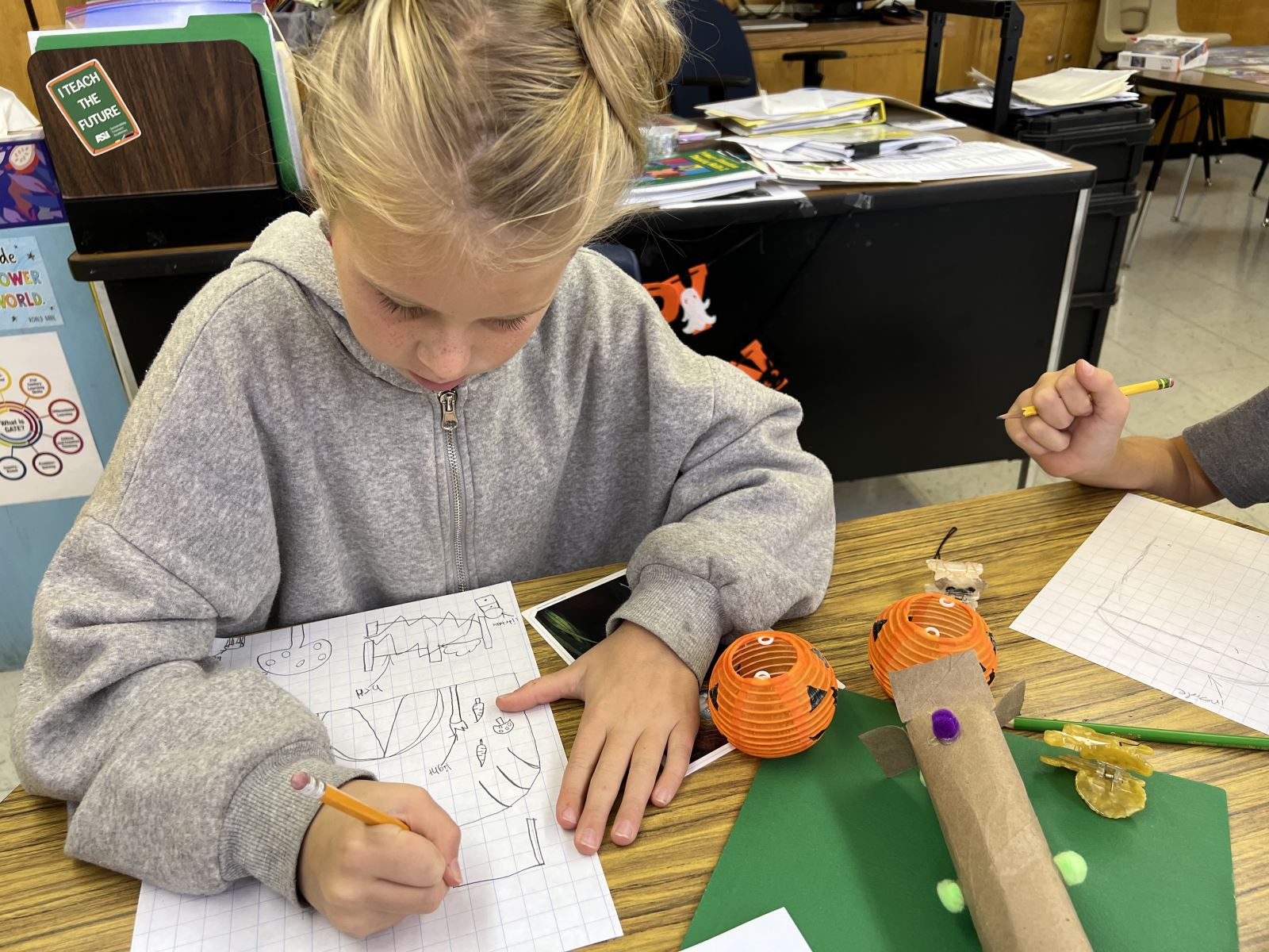 Wooden circle with a student's work showing symbols of themself