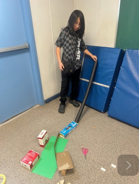 Picture of students engineering Rube Goldberg Machines
