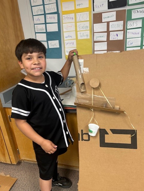 Picture of students engineering Rube Goldberg Machines