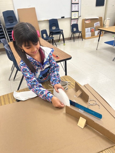 Picture of students engineering Rube Goldberg Machines