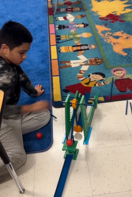 Picture of students engineering Rube Goldberg Machines