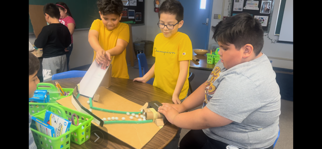 Picture of students engineering Rube Goldberg Machines