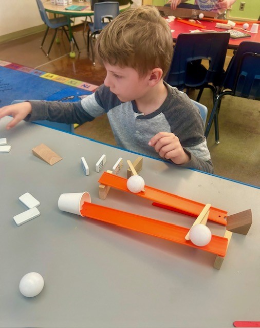 Picture of students engineering Rube Goldberg Machines