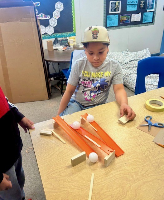 Picture of students engineering Rube Goldberg Machines