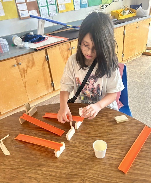 Picture of students engineering Rube Goldberg Machines