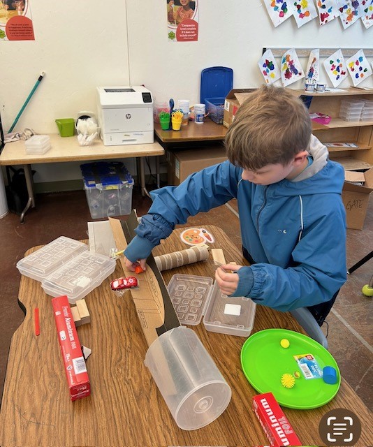 Picture of students engineering Rube Goldberg Machines