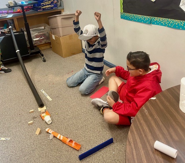 Picture of students engineering Rube Goldberg Machines