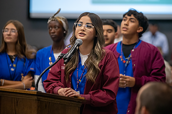 Student speaking at podium
