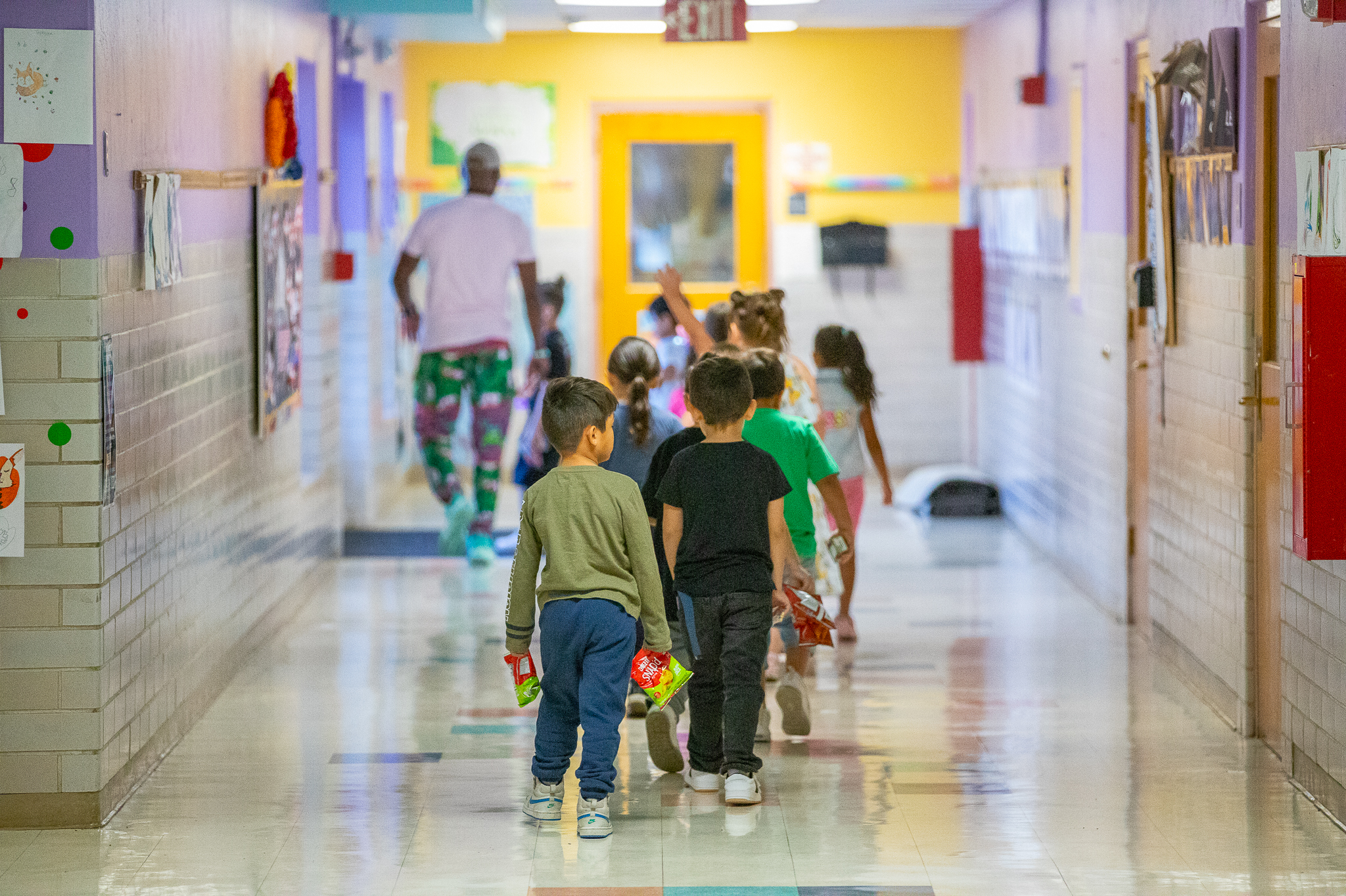 Little kids in school hallway