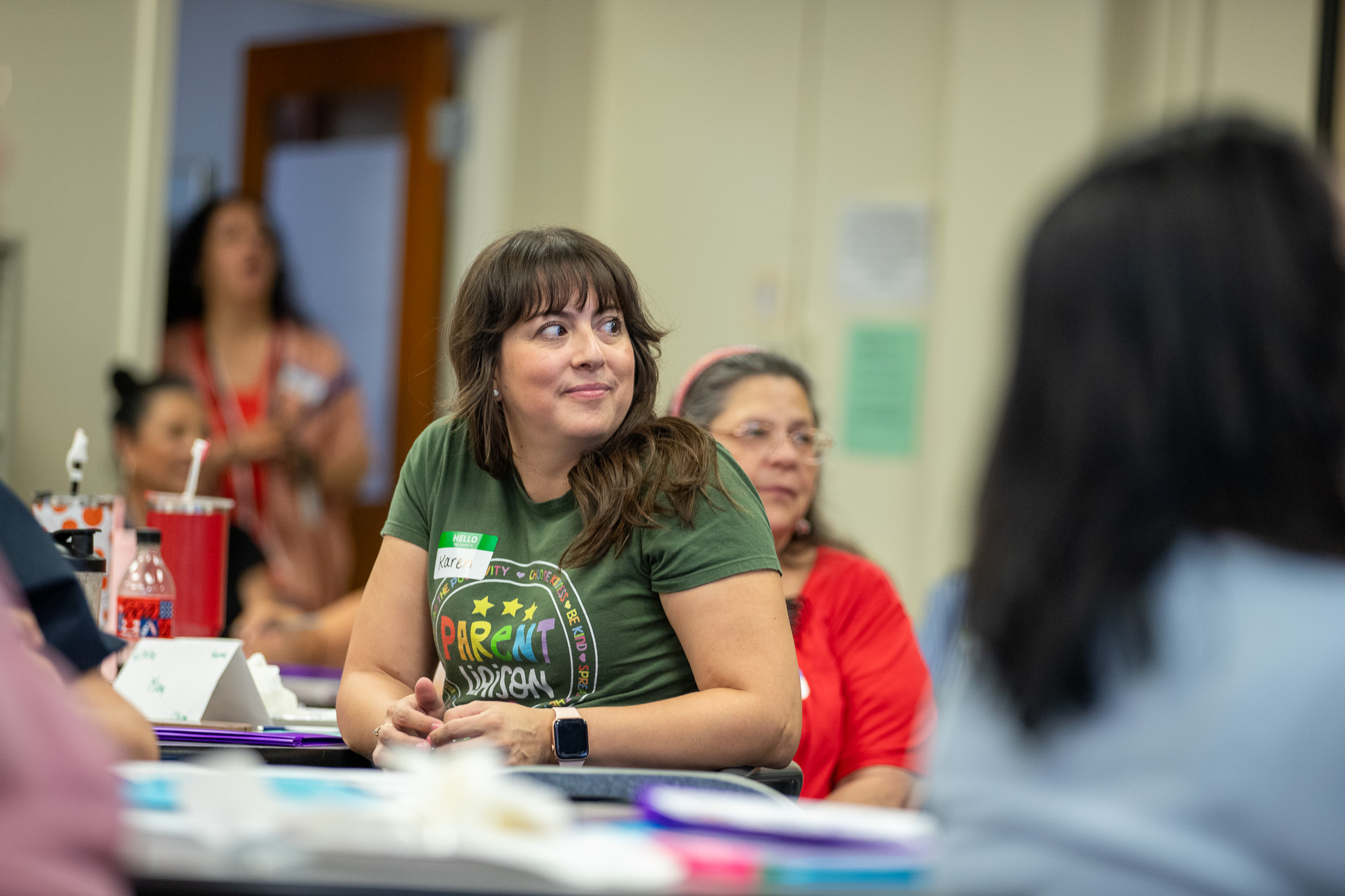 A woman looks over her shoulder during a presentation