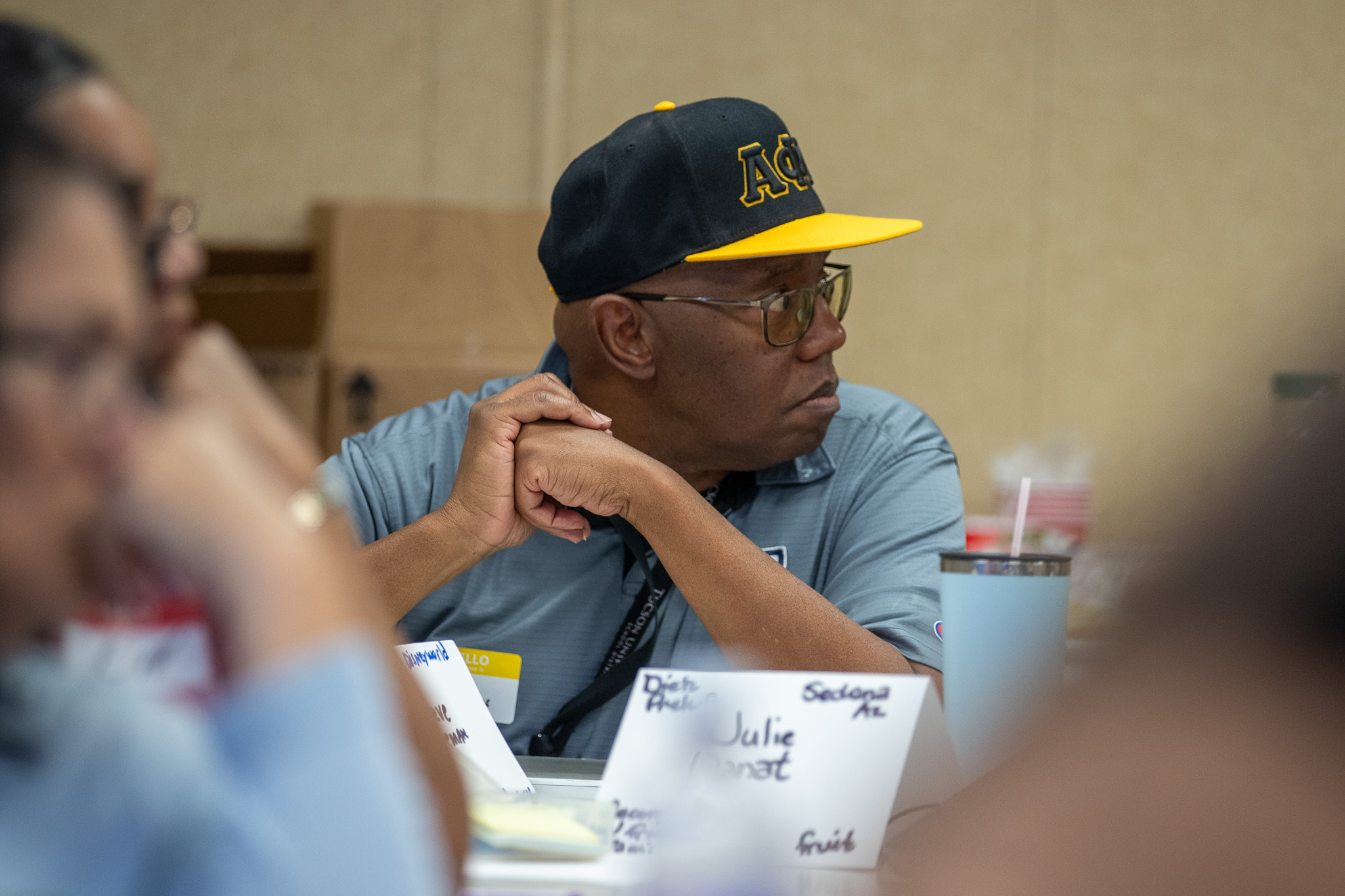 A man listens during a presentation