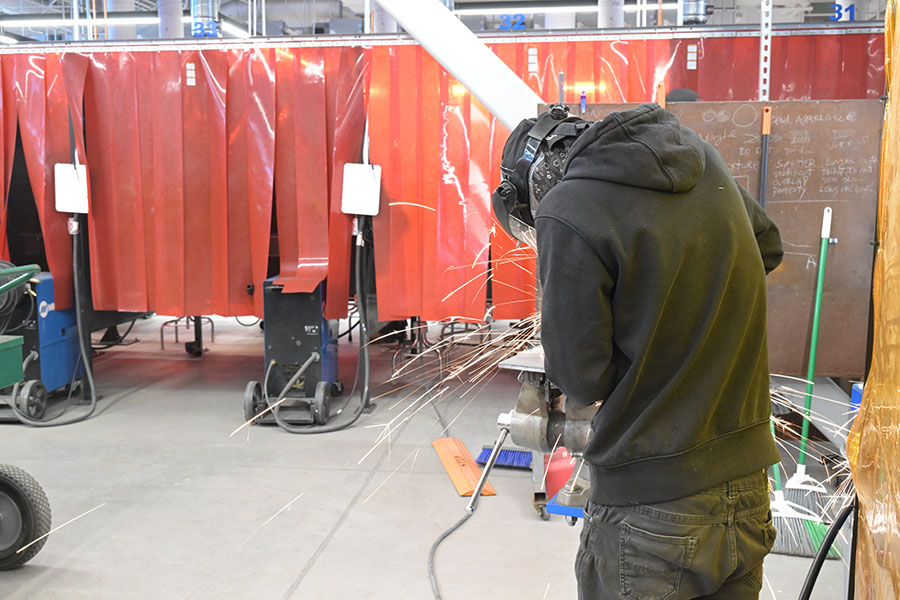 A man works with a drill
