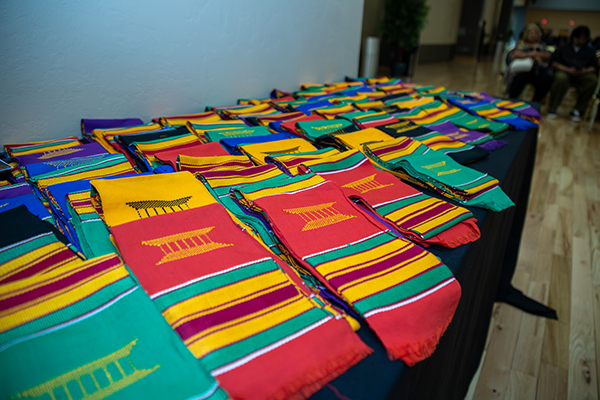 Colorful sashes piled on a table