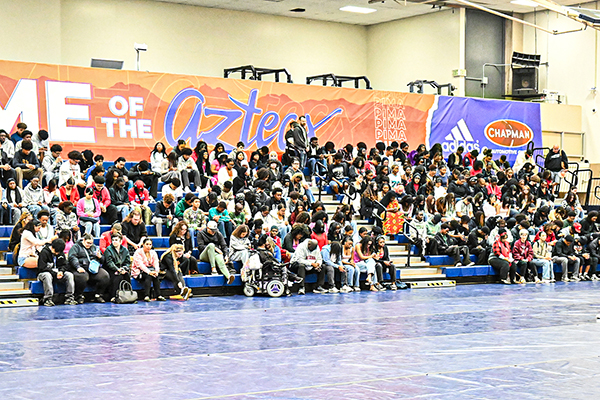 Students sit in the bleachers