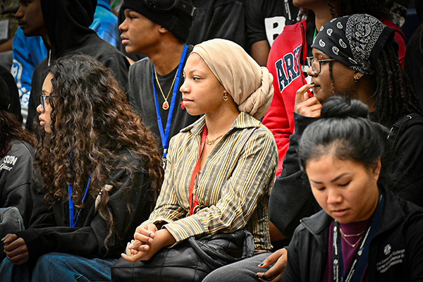 Close up of students sitting in the bleachers