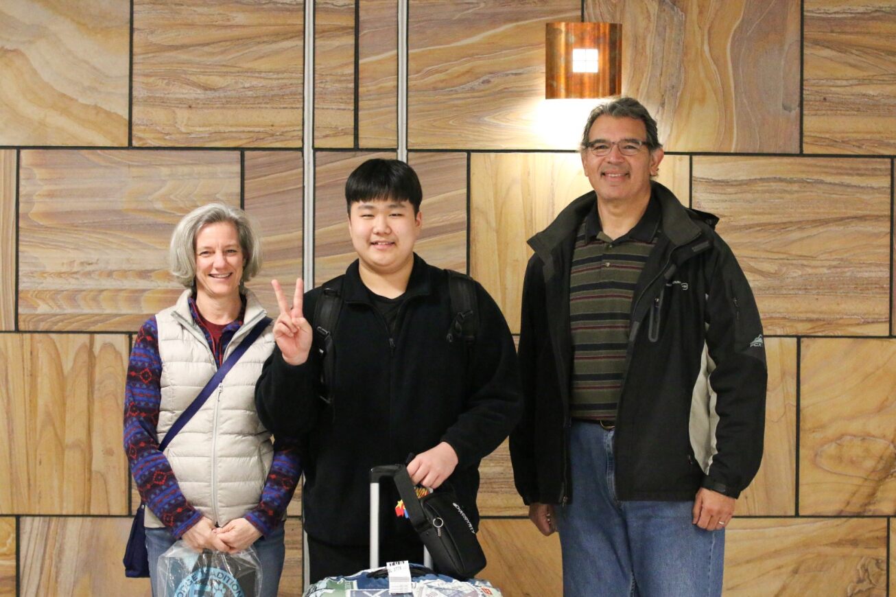 A host family poses with their TKAP student.