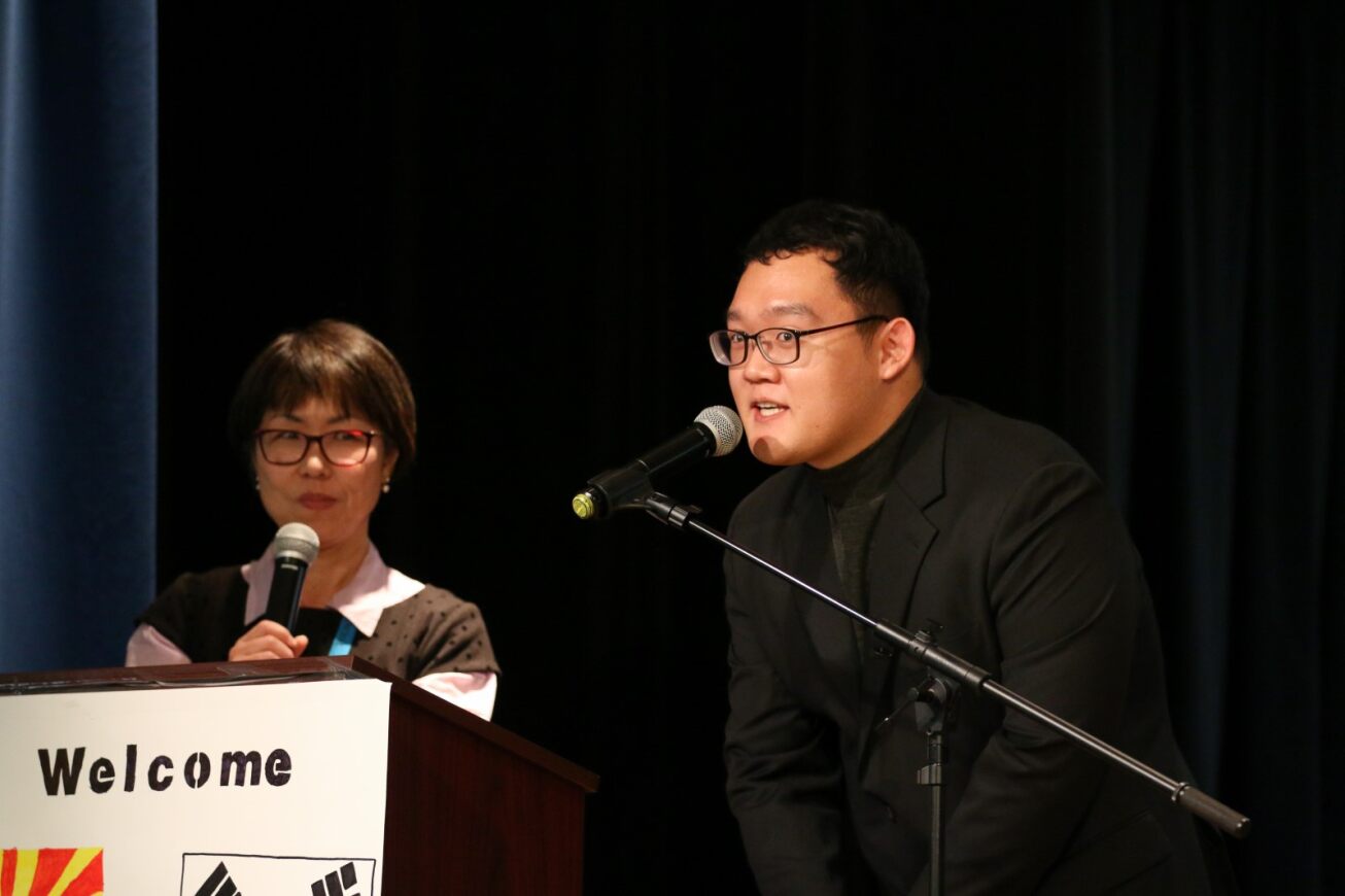 Staff talk about the program to students at the opening ceremony