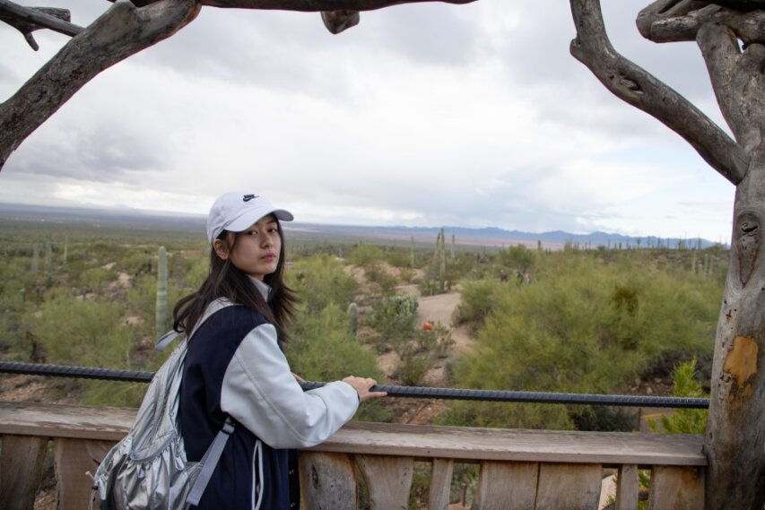 A Korean student looks out at the desert surroundings