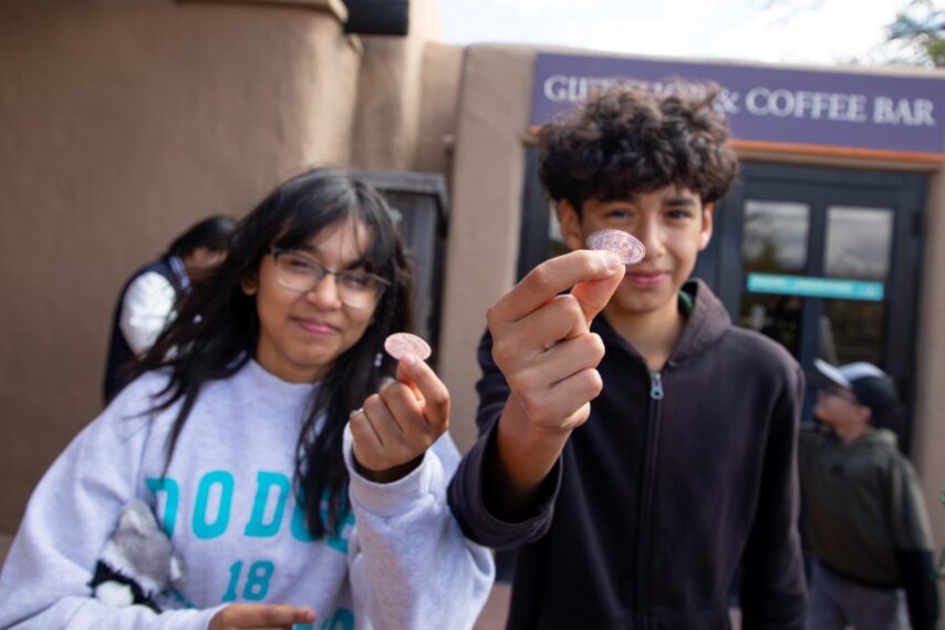 Two students show off their pressed pennies!