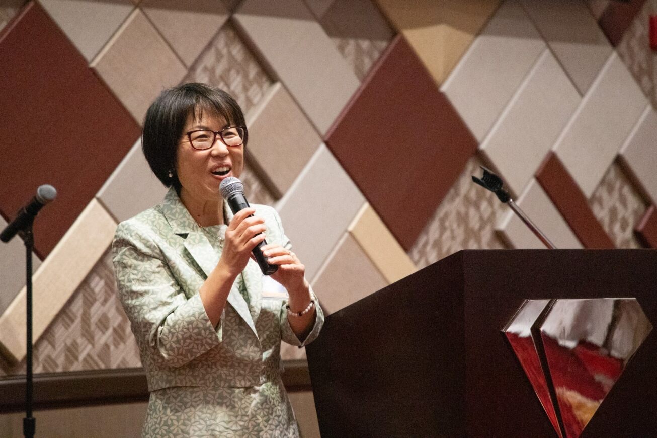 Yoon Lee talks to the audience at the appreciation dinner