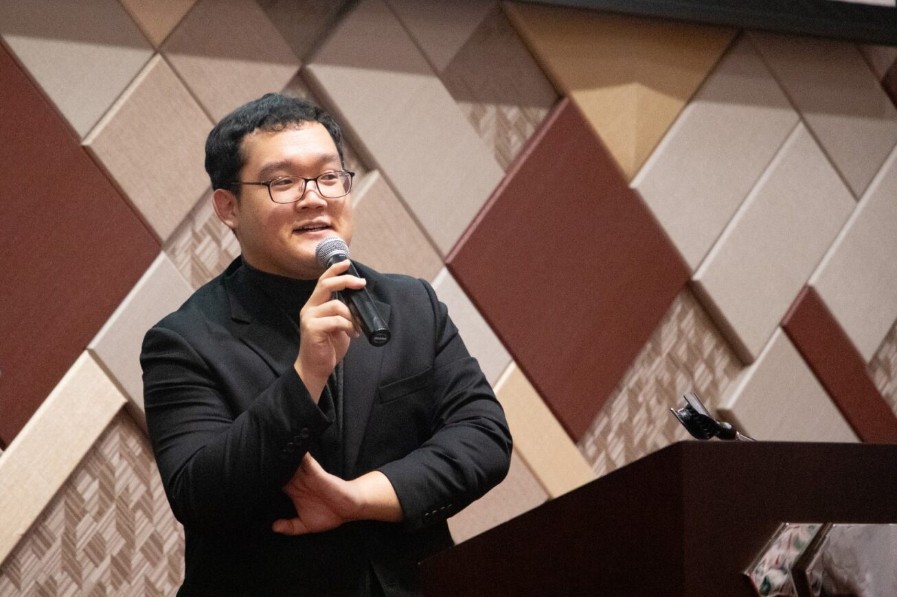 A man addresses the audience at the appreciation dinner