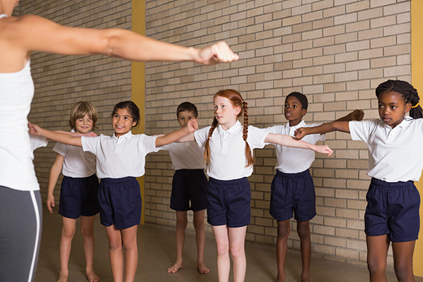 Students meditate with a teacher