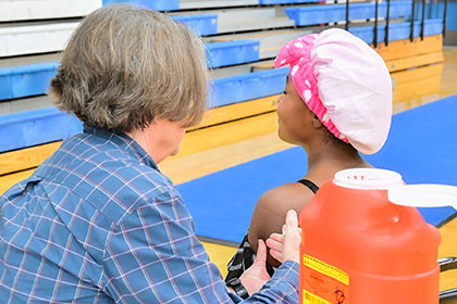 Young child receives a vaccination.
