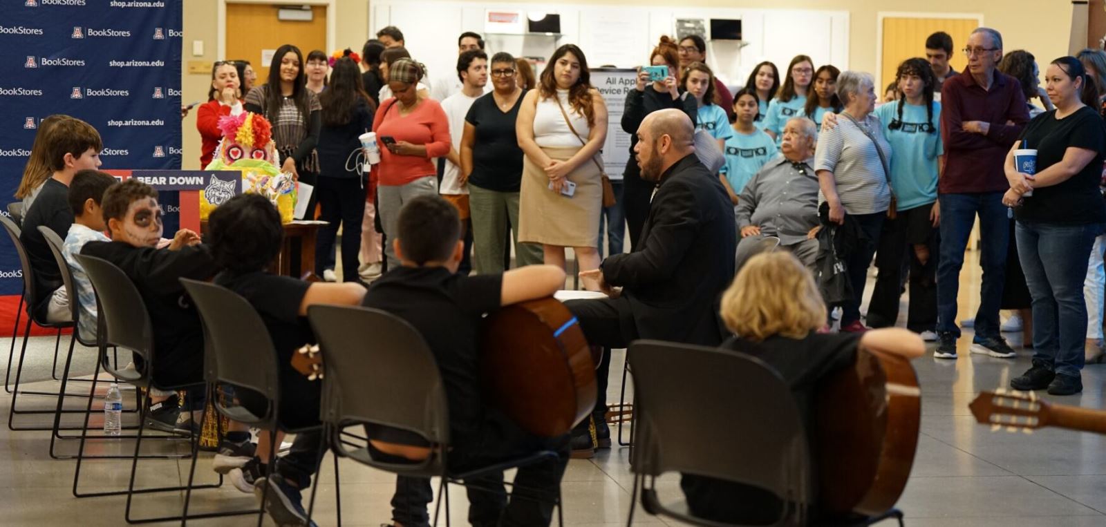 Students get ready to perform in front of a crowd.