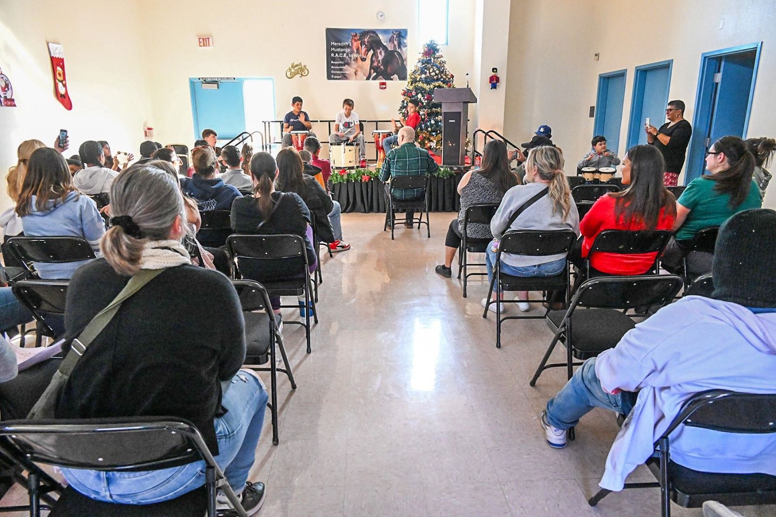 The audience enjoys the winter holiday concert.