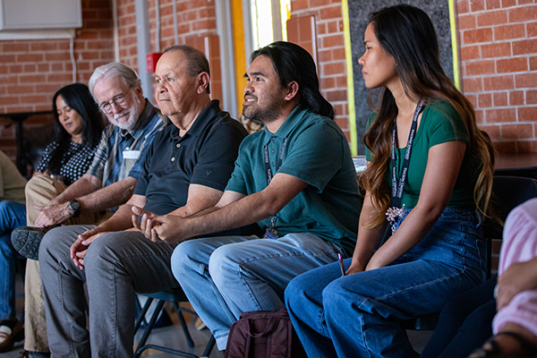 A group of school social workers sit in a row