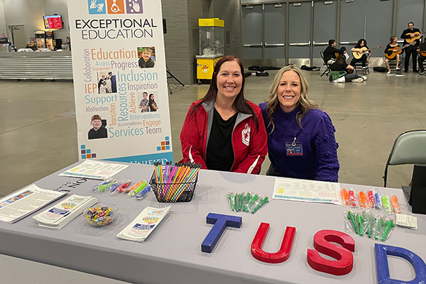 Exceptional Education staff a booth at Step Up