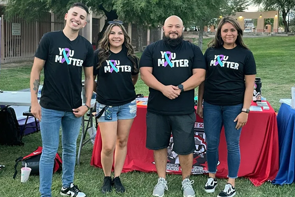 Exceptional Education social workers at a booth wearing t-shirts labelled, You Matter.