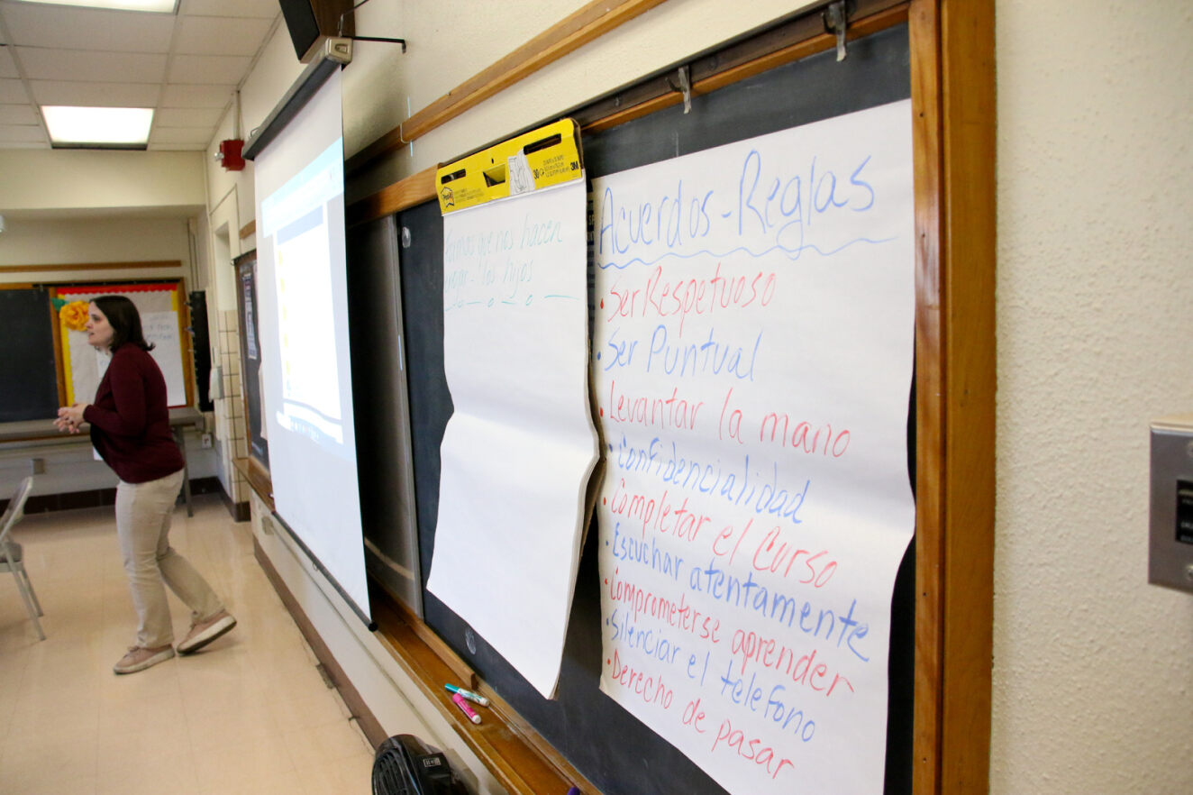 A teacher stands at the board during a class at the Menlo FRC.
