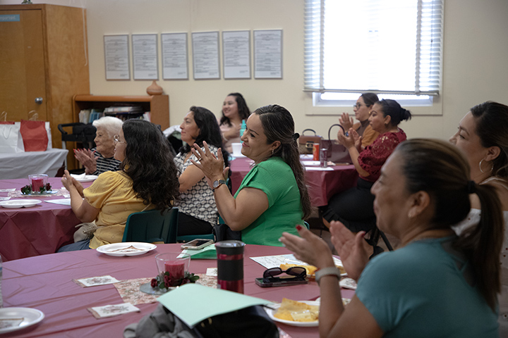 A group of women clap