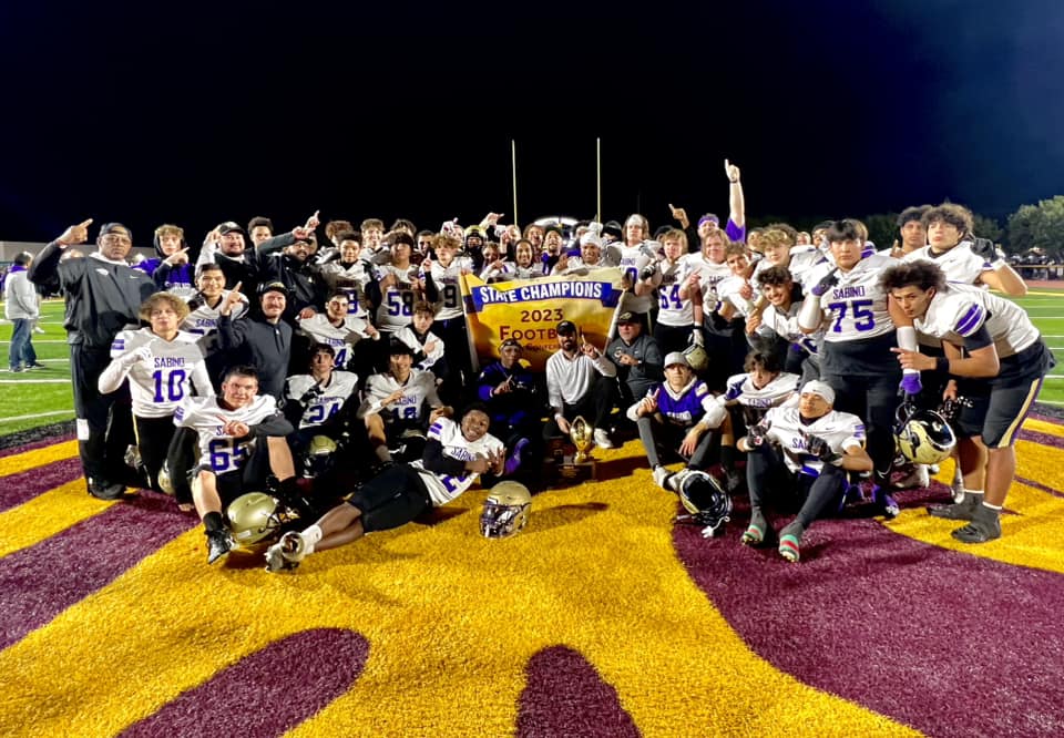The Sabino football team poses after the winning game.