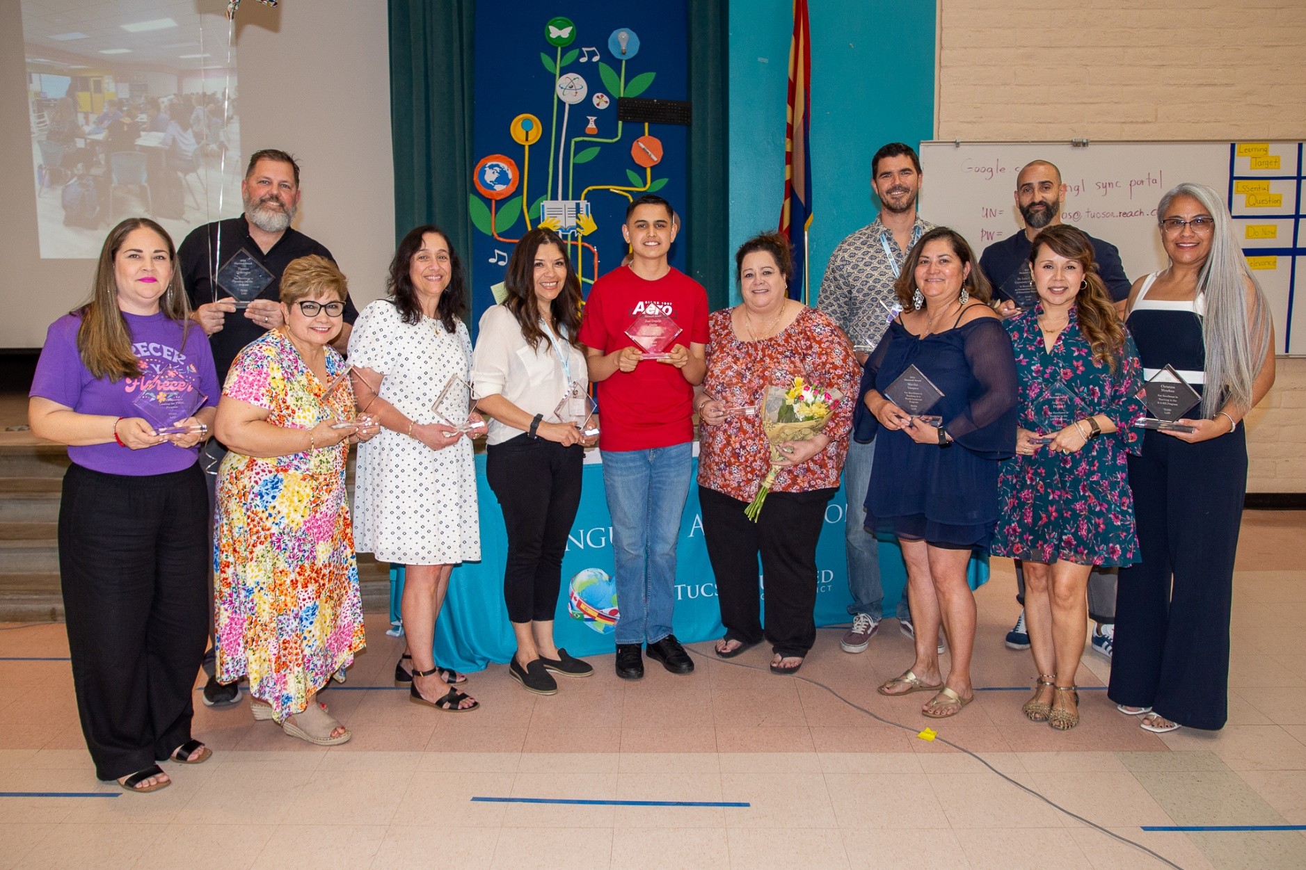 Recipients of the Diamond Award smile with their awards.