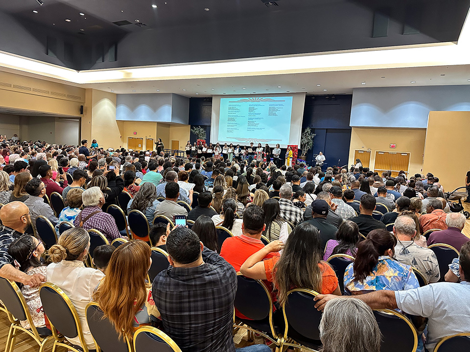 An auditorium filled with families