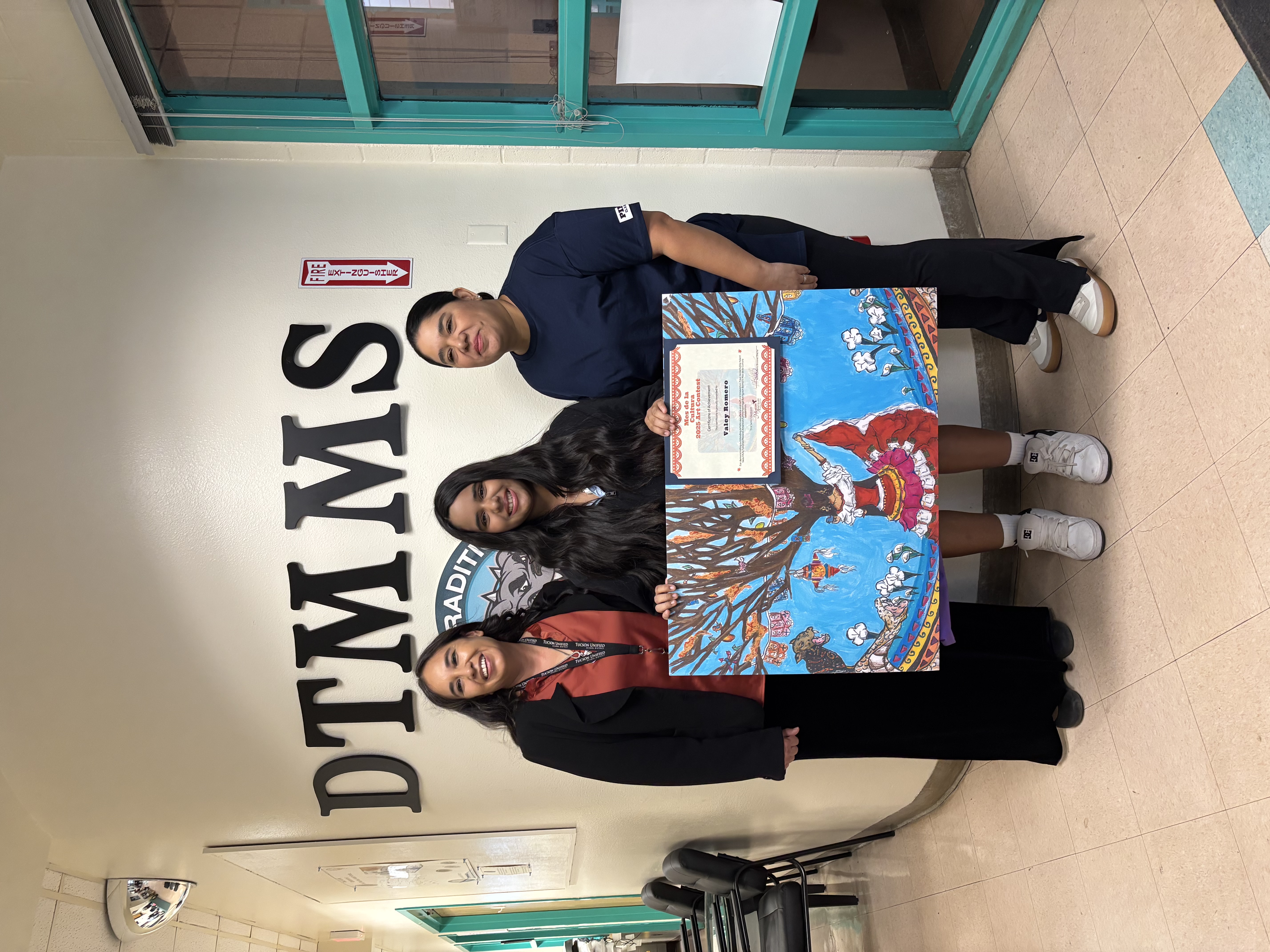 A family walks in a hallway