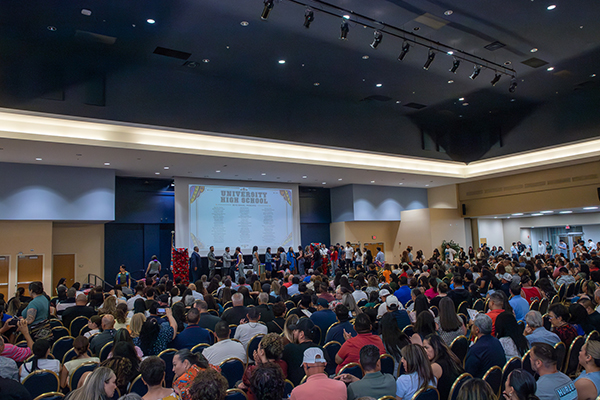 An auditorium of people during an awards ceremony