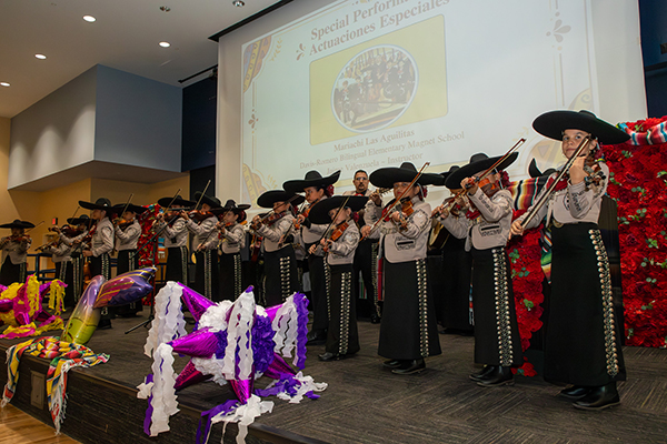 A student mariachi group performs on stage