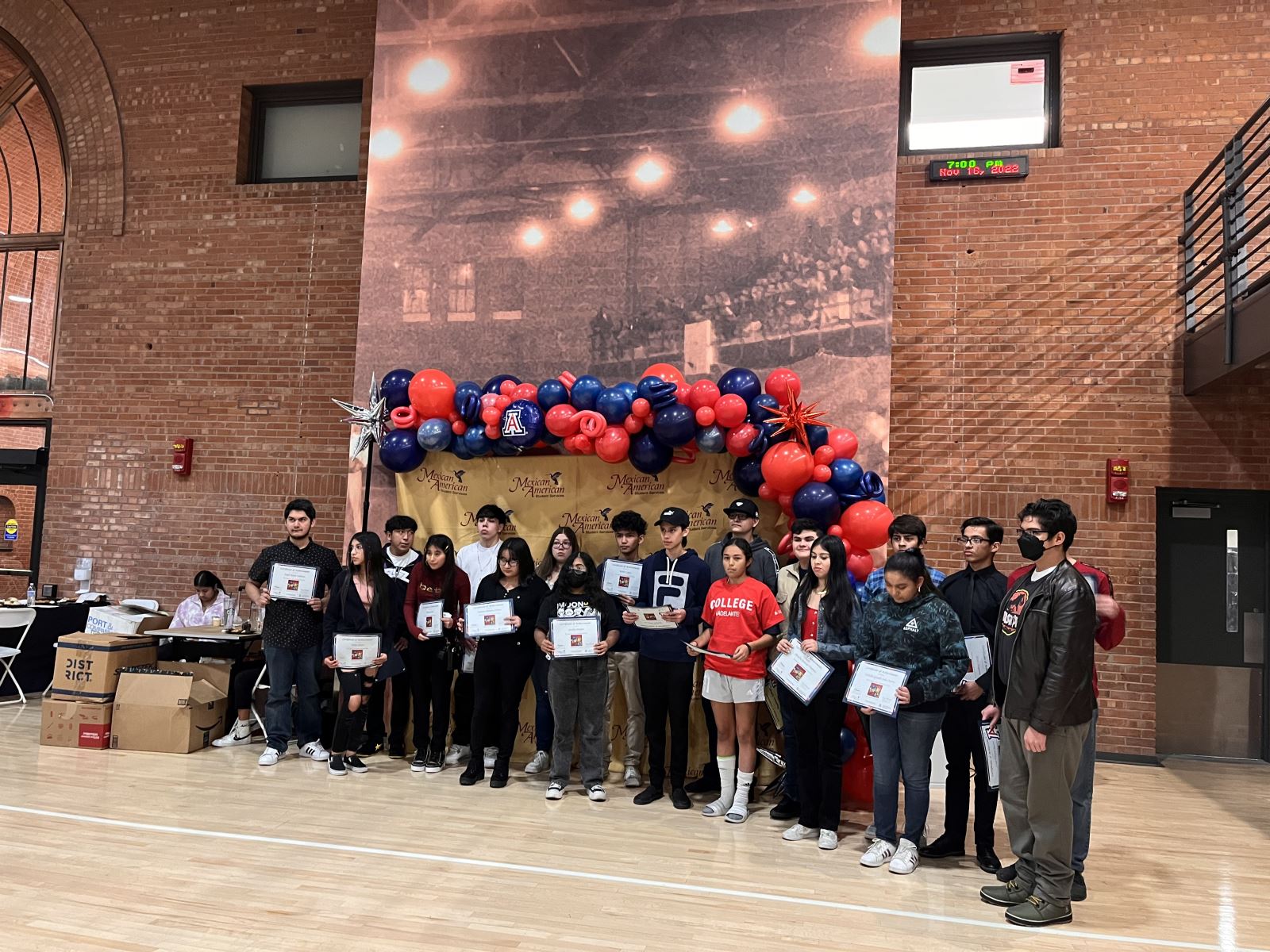 High school students who participated in college camp receiving their awards for program completion.