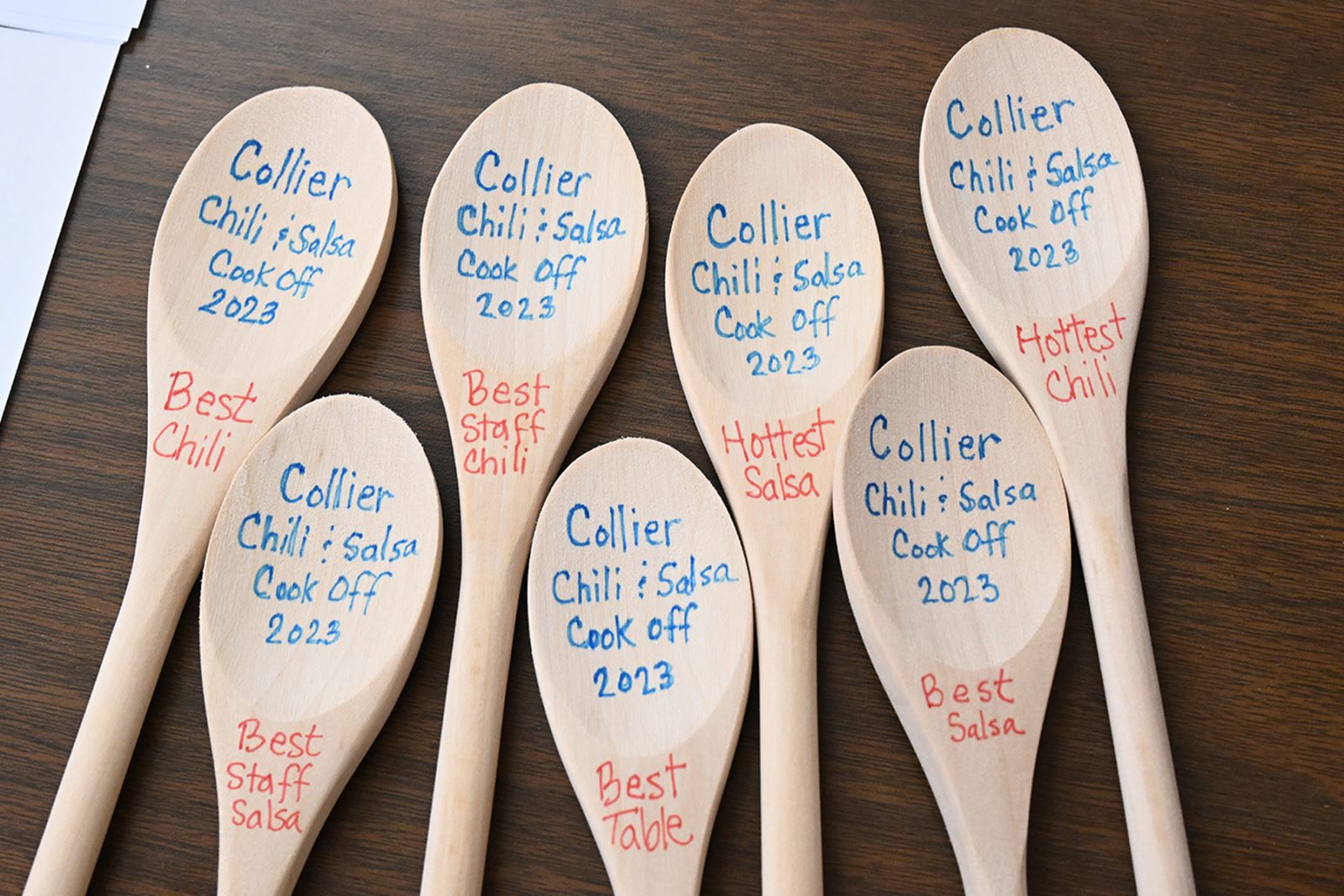 Wooden spoons were given out as awards for the best chilis.