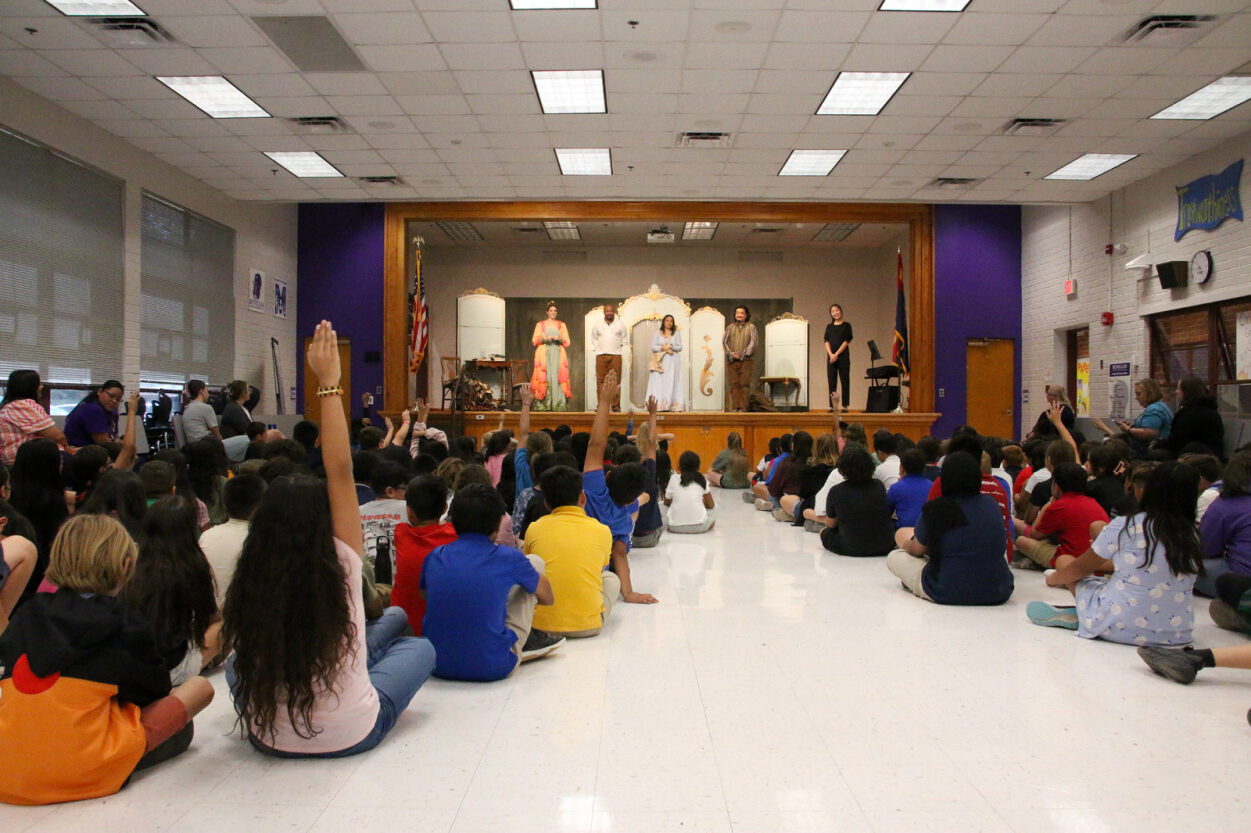 Students ask questions of the performers during the Q&A session