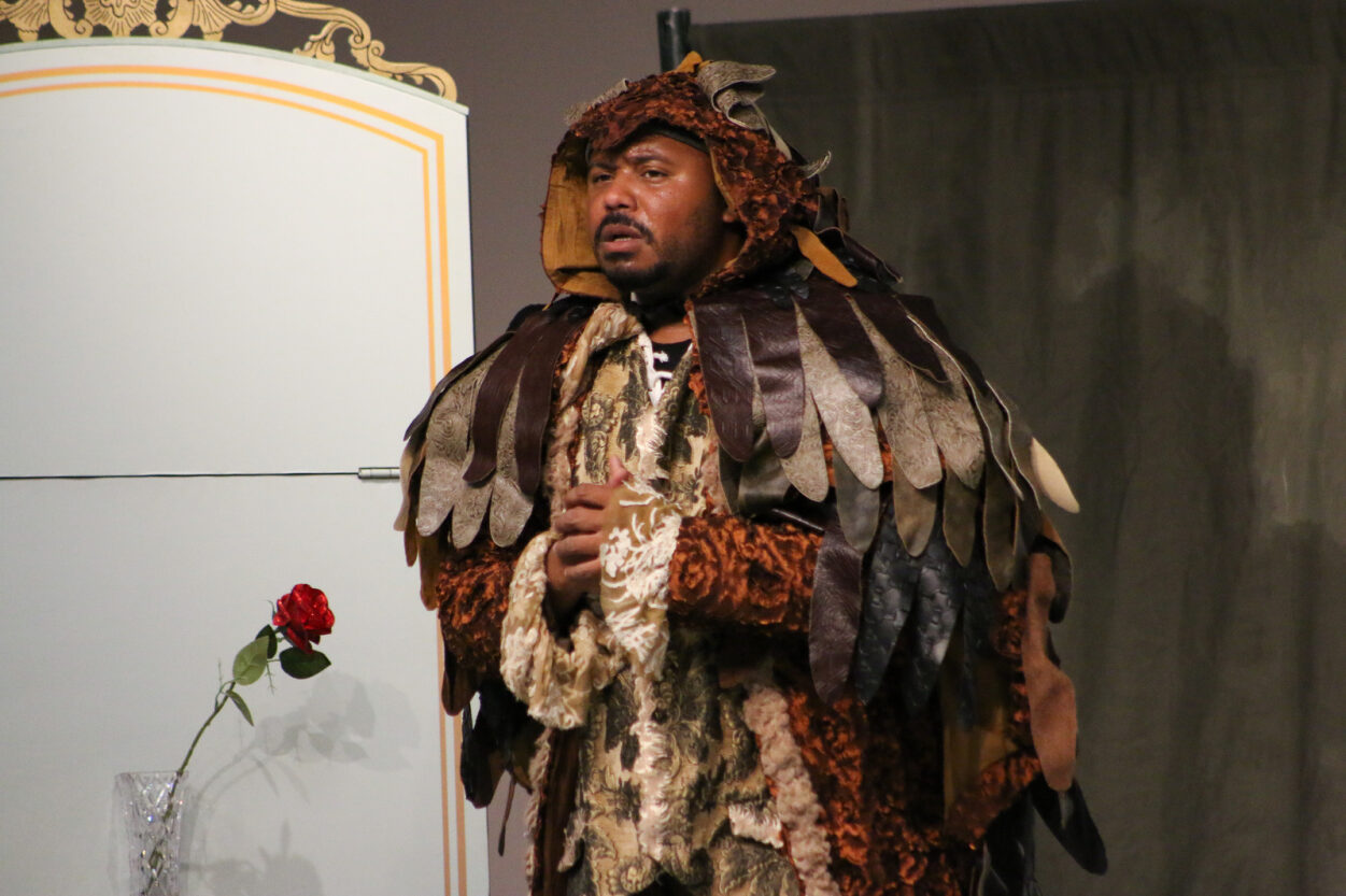 A man performs as the Beast in Beauty and the Beast.