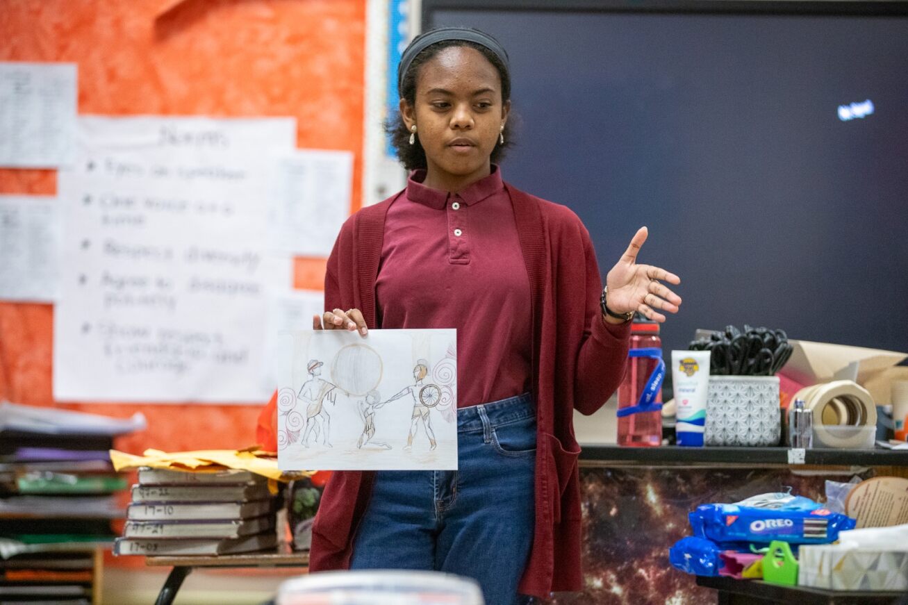 A student gives her presentation about the solar eclipse