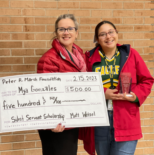 Santa Rita High School student Mya Gonzales is presented with a $500 check from principal Tamara Ray for earning the Silent Servant Scholarship award.