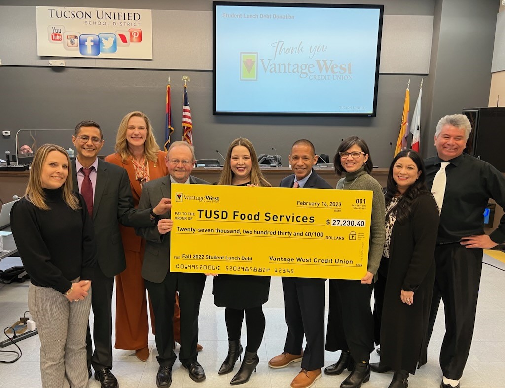 Vantage West Credit Union presents TUSD Food Services with a check for $27,230.40 to pay off 2022 student lunch debt.