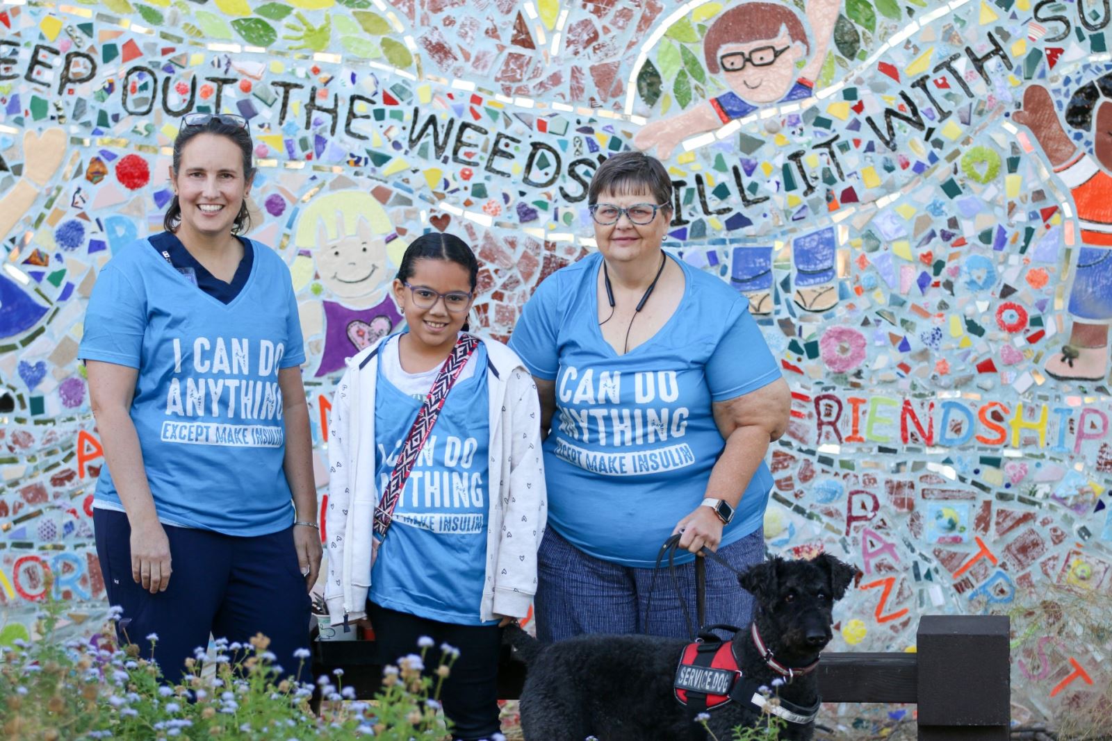 3rd grader Aurora (middle) poses with Dawn and Melissa, who help her manage her Type 1 diabetes at school.